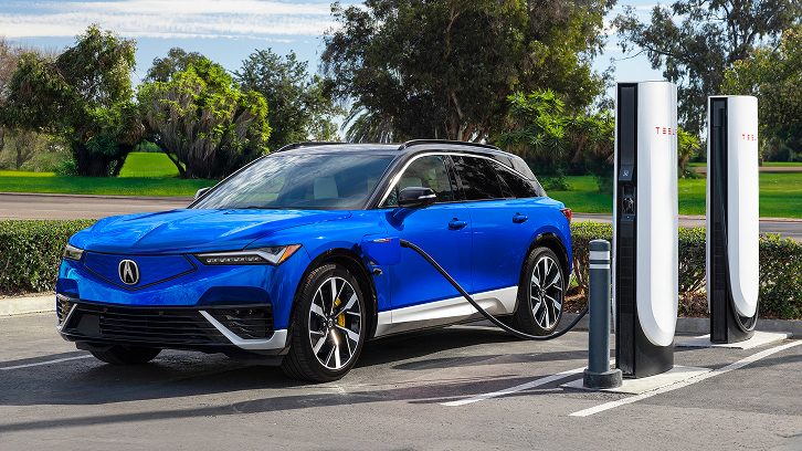 2025 Acura ZDX Type S charging in a Tesla Super Charger